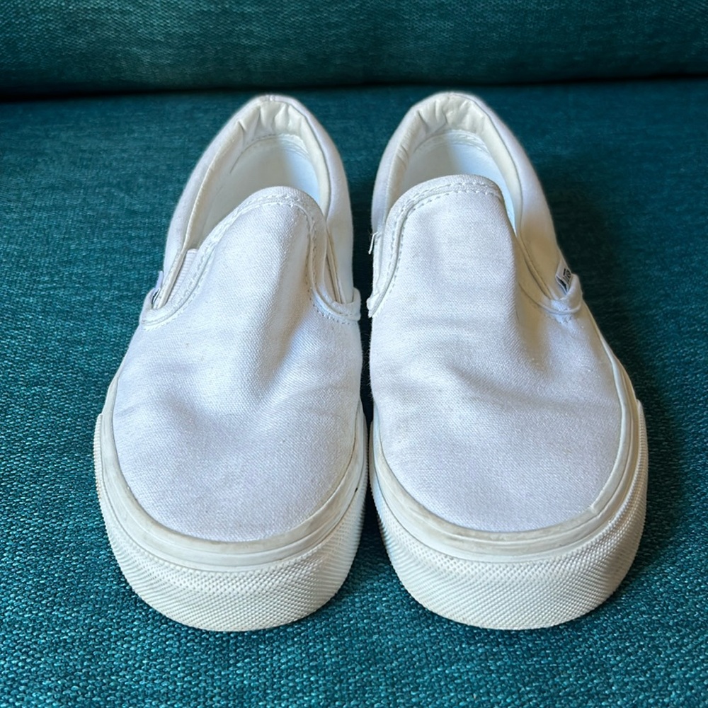 Vans slip on white shoes size 4 mens/ 5.5 women’s worn twice.